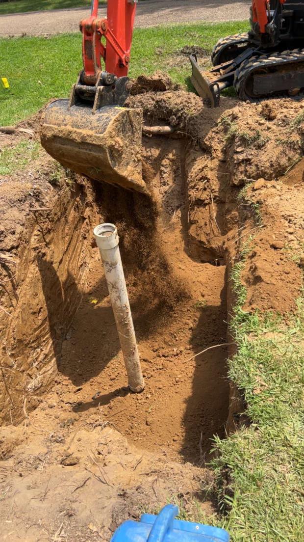 Sewer cleanout pipe set in a fresh trench