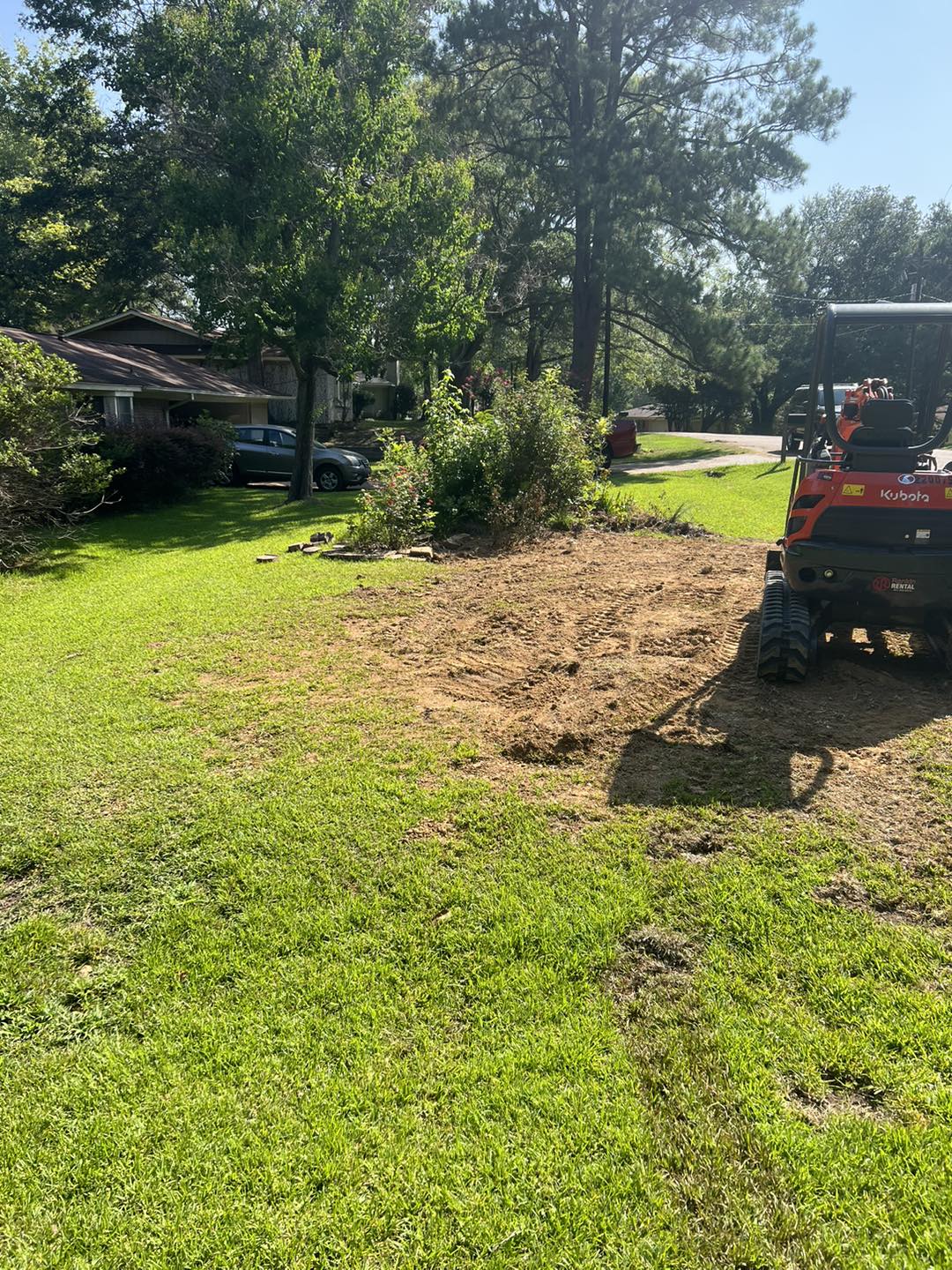 A yard graded and cleaned up after Clinton Plumbing Repair completed underground work